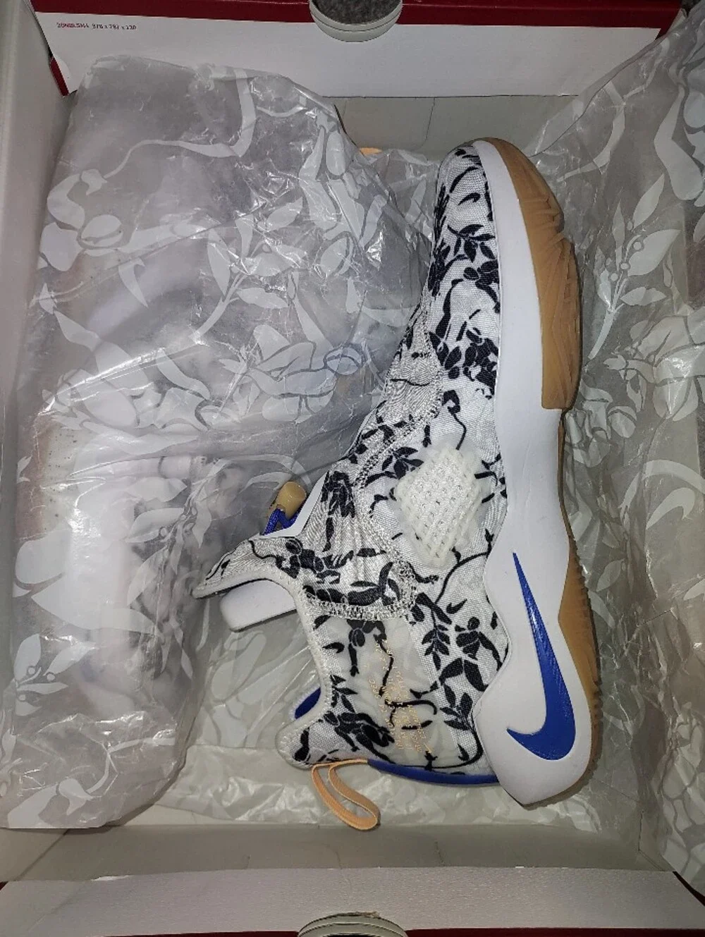Nike Men’s White Floral Training Shoes with Black Print and Blue Details